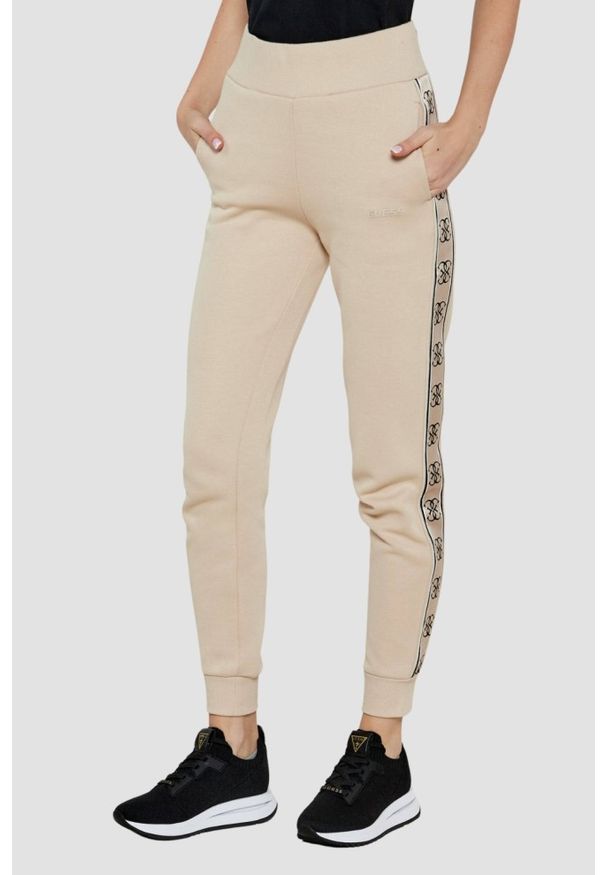 Guess - GUESS Beżowe spodnie dresowe damskie Britney, Rozmiar S. Kolor: beżowy. Materiał: dresówka