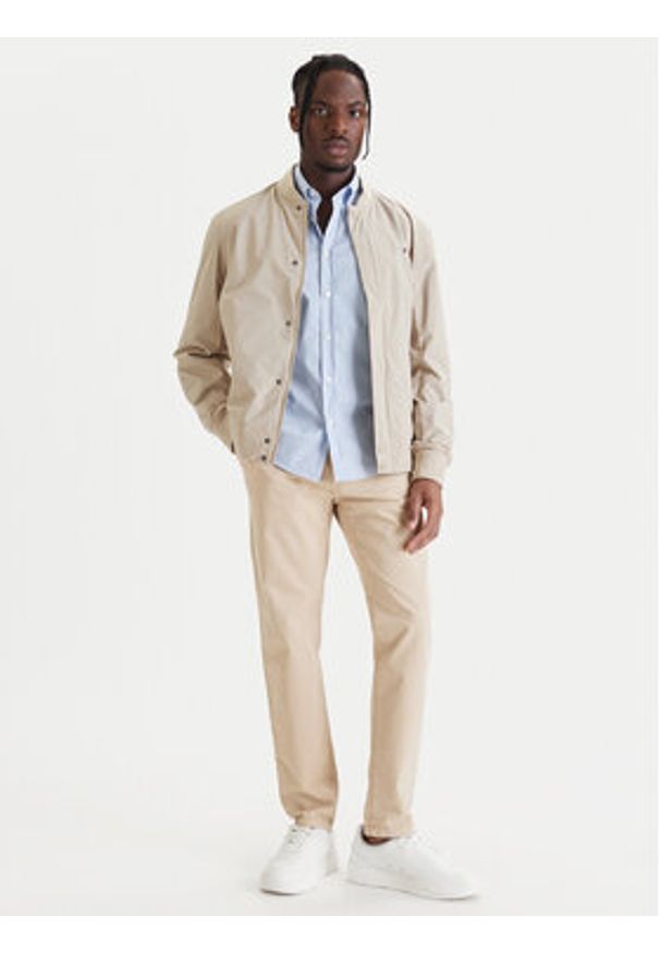 TOMMY HILFIGER - Tommy Hilfiger Kurtka bomber MW0MW36665 Beżowy Regular Fit. Kolor: beżowy. Materiał: syntetyk