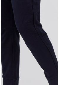 Armani Exchange - ARMANI EXCHANGE Granatowe męskie spodnie dresowe. Kolor: niebieski. Materiał: bawełna #3