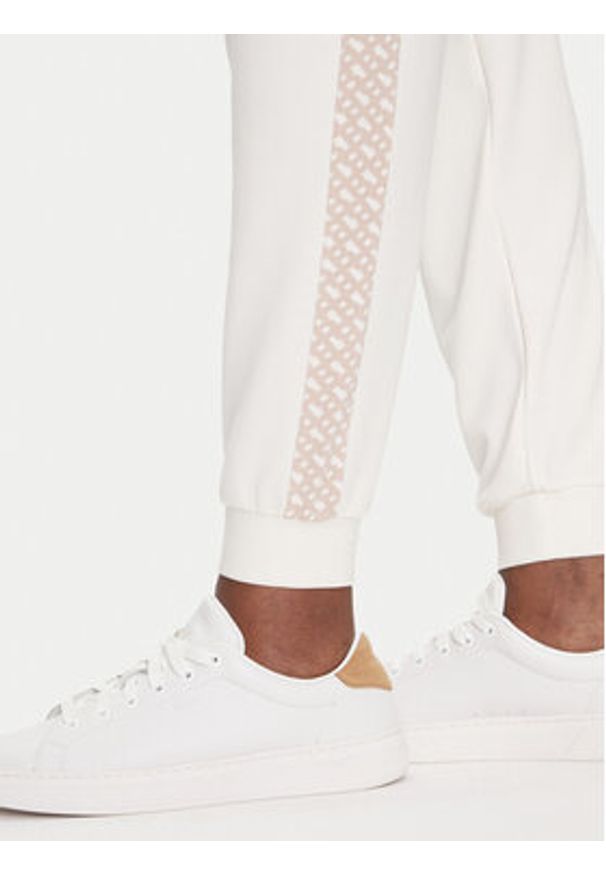 BOSS Spodnie dresowe Monogram 50535841 Écru Regular Fit. Materiał: dresówka, syntetyk