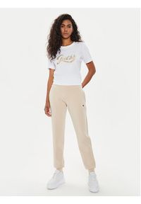 Guess Spodnie dresowe V4YB08 KCAY2 Beżowy Regular Fit. Kolor: beżowy. Materiał: syntetyk