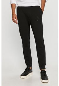 Armani Exchange - Spodnie. Kolor: czarny. Materiał: bawełna, materiał, dzianina, elastan, poliester. Wzór: gładki #1