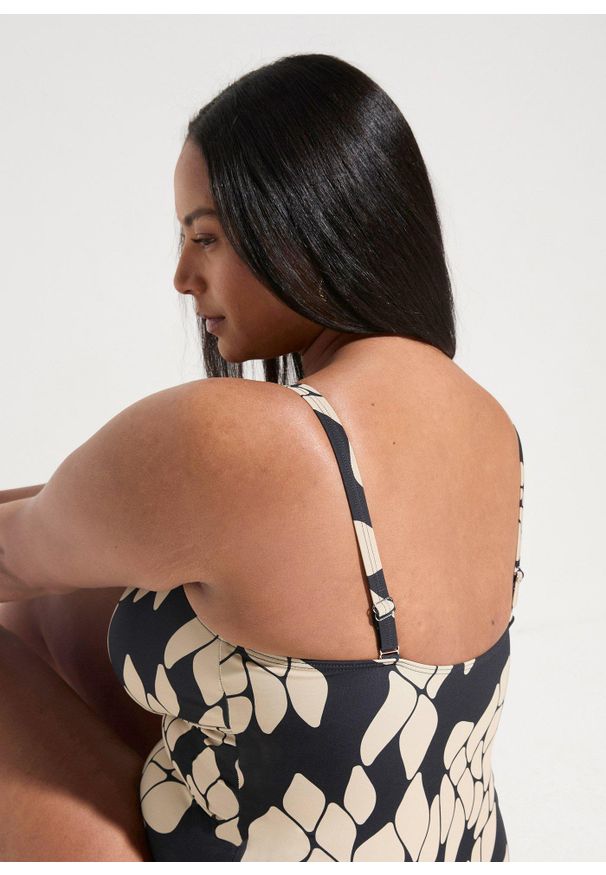 bonprix - Modelujący kostium kąpielowy średni stopień modelowania sylwetki, dekolt w serek. Kolor: czarny. Wzór: nadruk