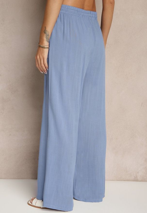 Renee - Niebieskie Szerokie Spodnie z Bawełną na Gumce z Kieszeniami Efridessa. Okazja: na co dzień. Stan: podwyższony. Kolor: niebieski. Materiał: bawełna. Styl: casual, klasyczny