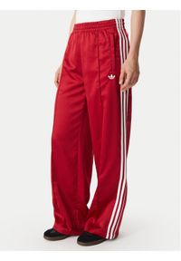 Adidas - adidas Spodnie dresowe Satin Sst Loose Trackpant KS7338 Czerwony Relaxed Fit. Kolor: czerwony. Materiał: syntetyk #1