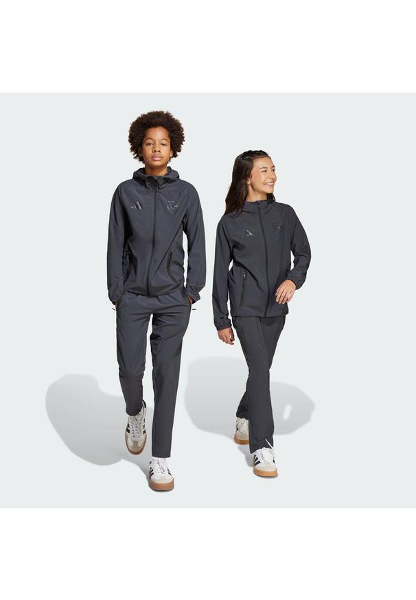Adidas - Spodnie Arsenal Tiro 25 Competition Vis Tech Travel Kids. Kolor: szary. Materiał: materiał. Sport: piłka nożna