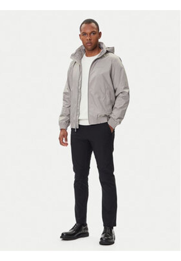 Calvin Klein Kurtka przejściowa LV04LC511G Beżowy Relaxed Fit. Kolor: beżowy. Materiał: syntetyk