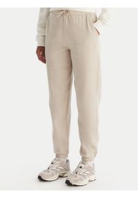 Reebok Spodnie dresowe Reebok X Ewa Chodakowska Evren RK25308CCW Beżowy Regular Fit. Kolor: beżowy. Materiał: bawełna