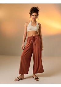 Sinsay - Wiskozowe spodnie wide leg - żółty. Kolor: żółty