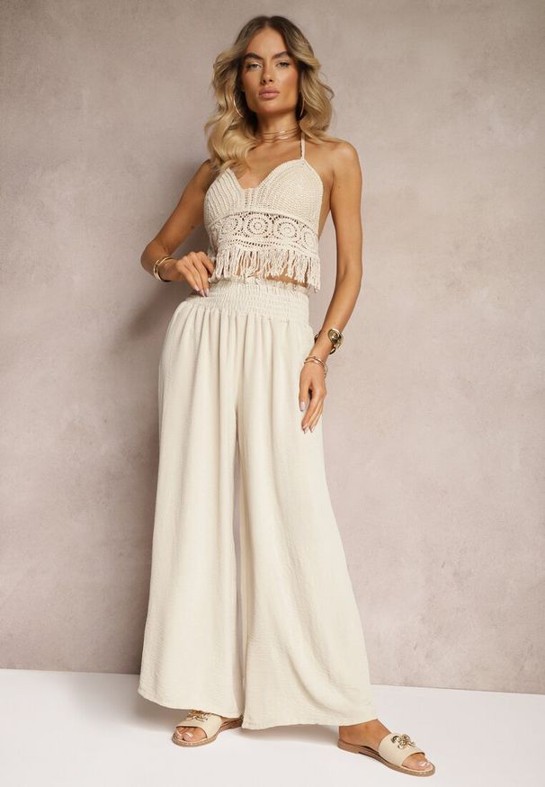 Renee - Beżowe Spodnie High Waist z Szerokimi Nogawkami i Gumką w Pasie Risabessa. Okazja: na co dzień. Stan: podwyższony. Kolor: beżowy. Styl: elegancki, casual