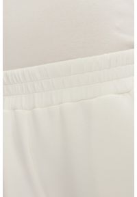 Guess - GUESS Dresowe damskie spodnie w kolorze ecru Cecilia Scuba, Rozmiar M. Kolor: beżowy. Materiał: dresówka #2