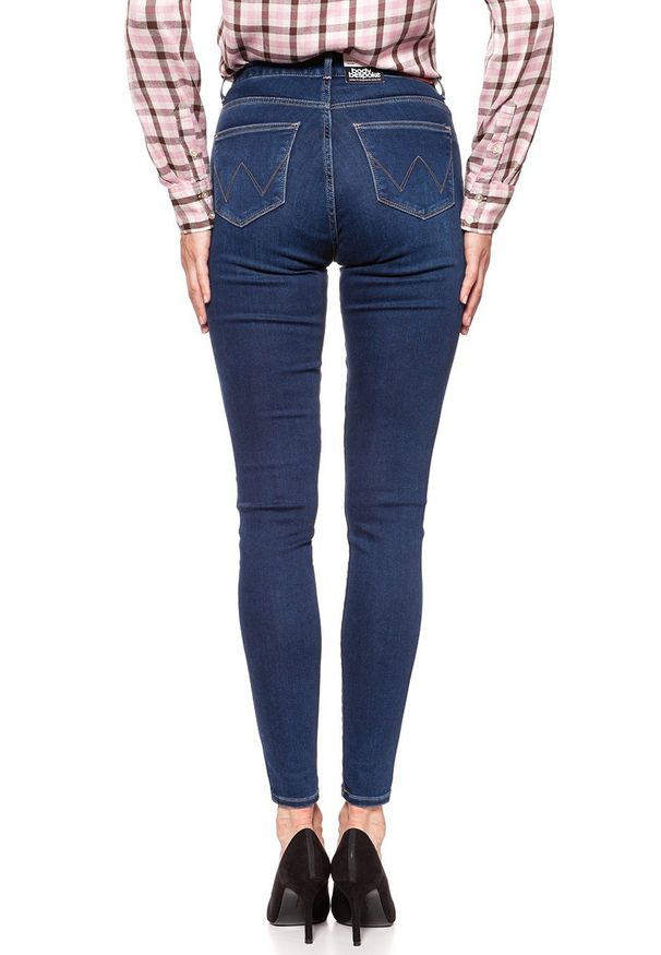 Wrangler - WRANGLER HIGH SKINNY COSY FEEL W27HRL21L 112128114. Stan: podwyższony. Wzór: jednolity, aplikacja