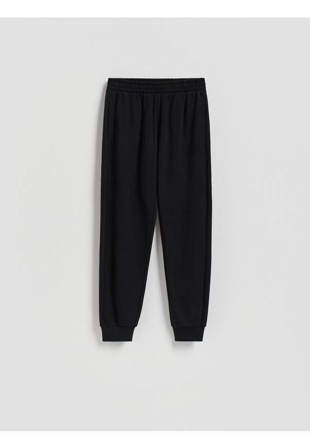 Reserved - Spodnie dresowe ze ściągaczem - czarny. Kolor: czarny. Materiał: dresówka