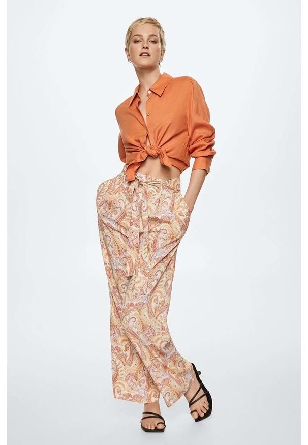 mango - Mango spodnie Nora damskie kolor pomarańczowy szerokie high waist. Stan: podwyższony. Kolor: pomarańczowy