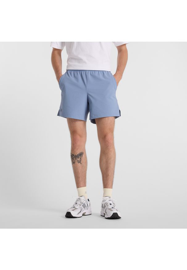 Spodenki męskie New Balance MS51402DUS – niebieskie. Kolor: niebieski. Materiał: nylon, tkanina, lycra, materiał. Sport: tenis