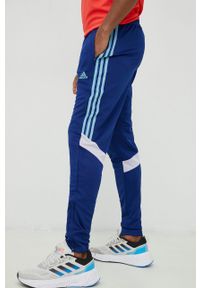 Adidas - adidas spodnie treningowe Tiro męskie kolor niebieski z aplikacją. Kolor: niebieski. Materiał: materiał, dzianina, skóra. Wzór: aplikacja. Sport: fitness #1