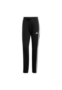 Adidas - Spodnie Essentials 3-Stripes French Terry Cuffed. Kolor: biały, wielokolorowy, czarny. Materiał: materiał