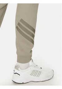Adidas - adidas Spodnie dresowe Future Icons 3-Stripes JD4862 Beżowy Regular Fit. Kolor: beżowy. Materiał: bawełna