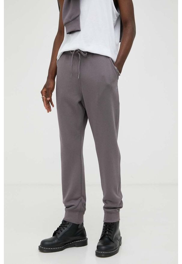 G-Star RAW - G-Star Raw spodnie dresowe kolor fioletowy gładkie. Kolor: fioletowy. Materiał: dresówka. Wzór: gładki