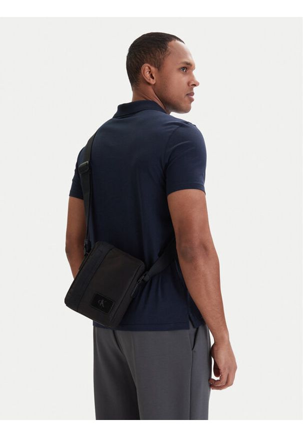 Calvin Klein Saszetka Canvas Mix Reporter LV04D3366G Czarny. Kolor: czarny. Materiał: materiał