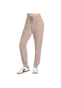 skechers - Spodnie sportowe damskie Skechluxe Elevate Jogger Pant. Kolor: beżowy. Materiał: poliester. Długość: długie
