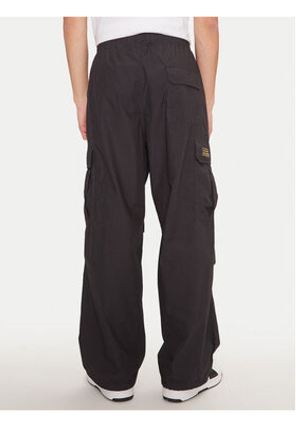 Champion Spodnie dresowe 220414 Czarny Loose Fit. Kolor: czarny. Materiał: bawełna