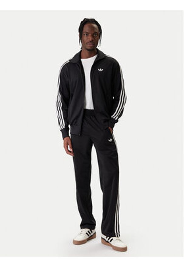 Adidas - adidas Bluza Firebird KD8312 Czarny Loose Fit. Kolor: czarny. Materiał: syntetyk