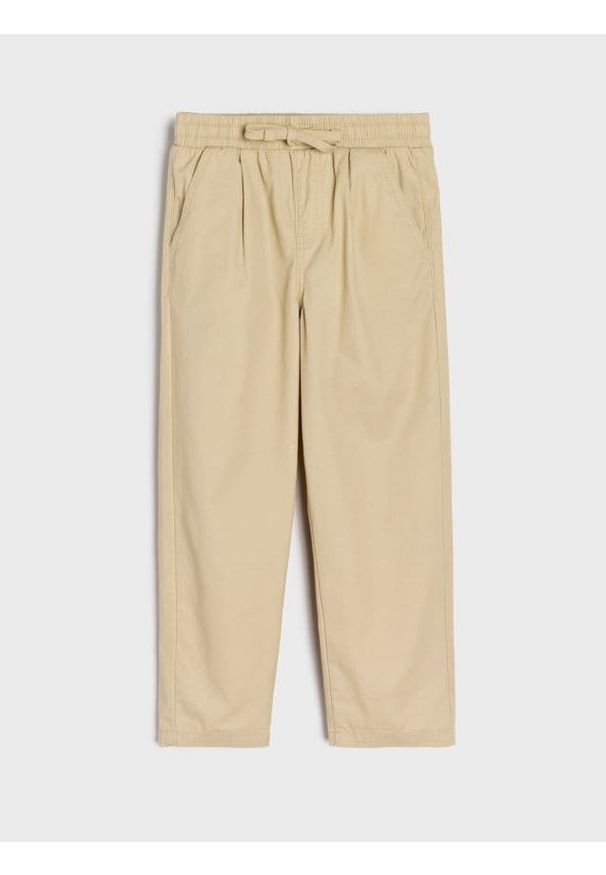 Sinsay - Spodnie - beżowy. Kolor: beżowy