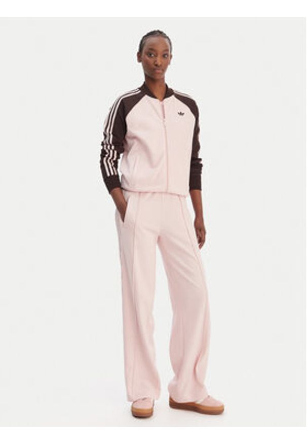 Adidas - adidas Spodnie dresowe Firebird Lace KC6444 Różowy Loose Fit. Kolor: różowy. Materiał: syntetyk