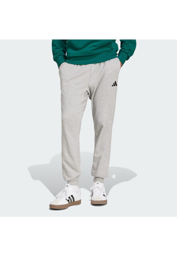 Adidas - Spodnie Essentials Feel Cozy French Terry. Kolor: czarny, szary, wielokolorowy. Materiał: materiał, dresówka. Sport: fitness