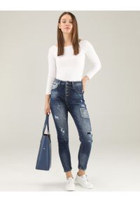 Unisono - JEANSY Z PRZETARCIAMI. Materiał: jeans. Wzór: aplikacja, gładki. Styl: klasyczny