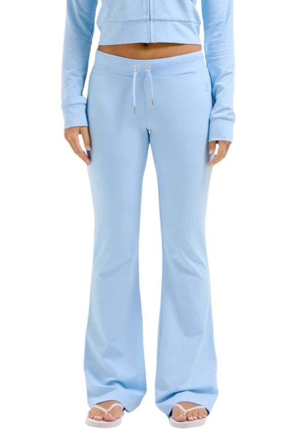 Juicy Couture - JUICY COUTURE Błękitne damskie spodnie dresowe Single Jersey Apollo Low Rise. Kolor: niebieski. Materiał: dresówka, jersey
