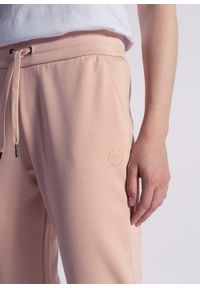 Spodnie dresowe damskie różowe Armani Exchange 8NYP97 YJ1GZ 14AA. Kolor: czarny. Materiał: dresówka