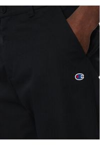 Champion Spodnie materiałowe 220715 Czarny Regular Fit. Kolor: czarny. Materiał: bawełna, syntetyk