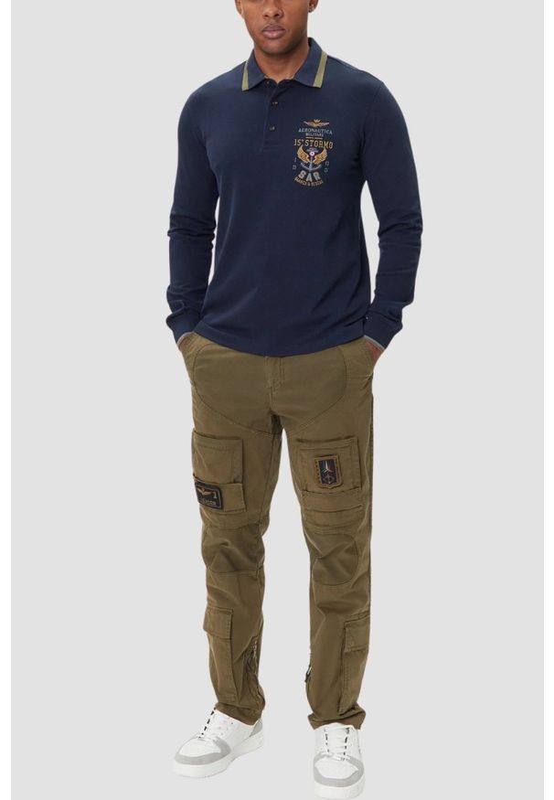Aeronautica Militare - AERONAUTICA MILITARE Granatowy bawełniany męski longsleeve polo, Rozmiar L. Okazja: na co dzień. Typ kołnierza: polo. Kolor: niebieski. Materiał: bawełna. Długość rękawa: długi rękaw. Styl: casual, klasyczny, sportowy