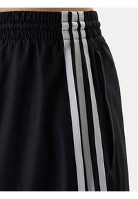 Adidas - adidas Spodnie dresowe Firebird Adilenium KD2914 Czarny Regular Fit. Kolor: czarny. Materiał: syntetyk #3