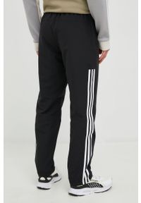 Adidas - adidas spodnie dresowe męskie kolor czarny z aplikacją. Kolor: czarny. Materiał: dresówka. Wzór: aplikacja #4
