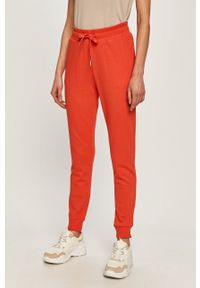 Armani Exchange - Spodnie. Kolor: czerwony. Materiał: bawełna, materiał, dzianina, elastan. Wzór: gładki #1