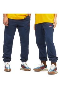 Spodnie New Balance UP21500NGO - granatowe. Kolor: niebieski. Materiał: materiał, dresówka. Sport: fitness