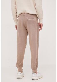 Calvin Klein Jeans spodnie dresowe bawełniane kolor brązowy gładkie. Kolor: brązowy. Materiał: bawełna, dresówka. Wzór: gładki #3