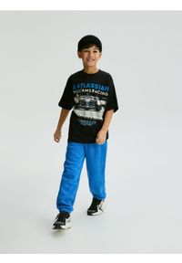 Reserved - Bawełniane spodnie jogger - jasnoniebieski. Kolor: niebieski. Materiał: bawełna. Wzór: gładki