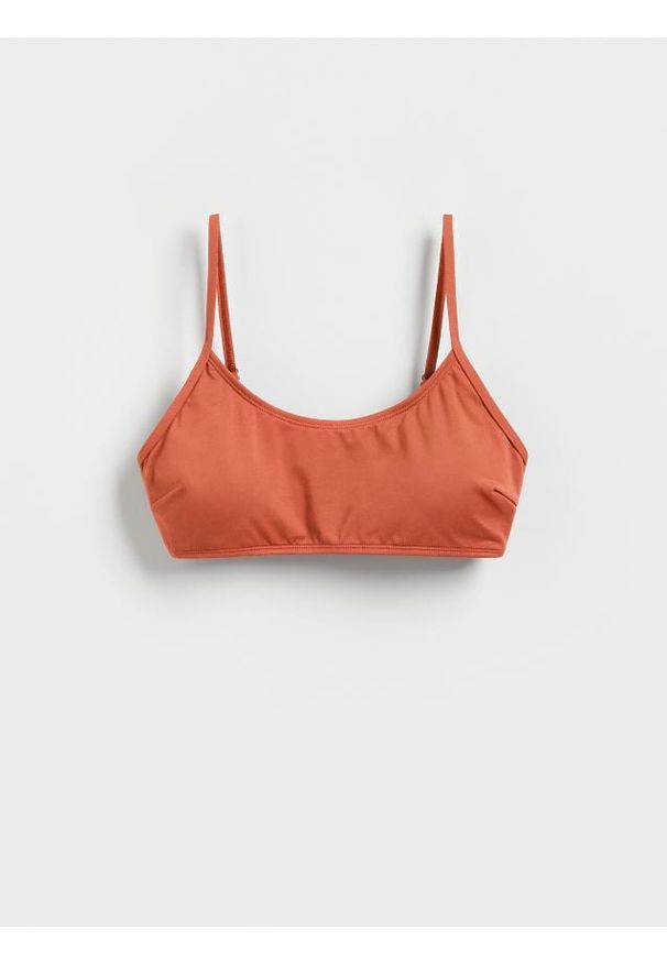 Reserved - Góra od bikini - bursztynowy. Kolor: pomarańczowy. Materiał: dzianina. Wzór: gładki