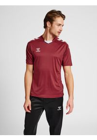 Koszulka piłkarska z krótkim rękawem męska Hummel Core XK Poly Jersey S/S. Kolor: czerwony, wielokolorowy, brązowy. Materiał: jersey. Długość rękawa: krótki rękaw. Długość: krótkie. Sport: piłka nożna