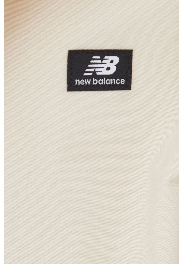 New Balance kurtka damska kolor beżowy przejściowa oversize. Kolor: beżowy. Materiał: bawełna. Długość rękawa: raglanowy rękaw. Długość: długie