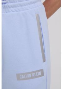 Calvin Klein Performance - Spodnie. Kolor: niebieski. Materiał: dzianina. Wzór: gładki #3