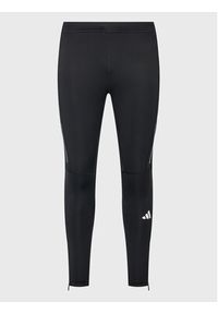 Adidas - adidas Legginsy Own the Run Leggings HM8444 Czarny Fitted Fit. Kolor: czarny. Materiał: syntetyk. Sport: bieganie