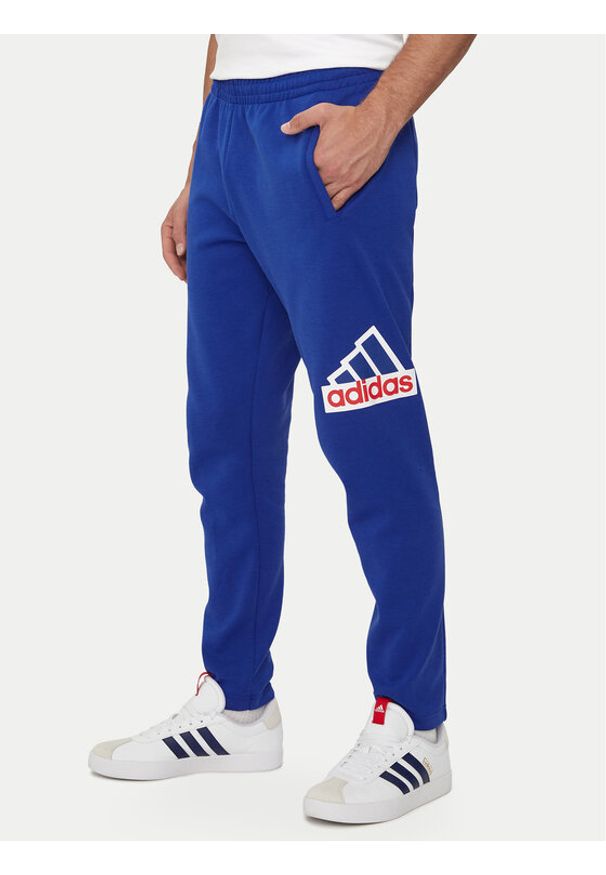 Adidas - adidas Spodnie dresowe Future Icons Badge of Sport IS9594 Niebieski Regular Fit. Kolor: niebieski. Materiał: bawełna, syntetyk