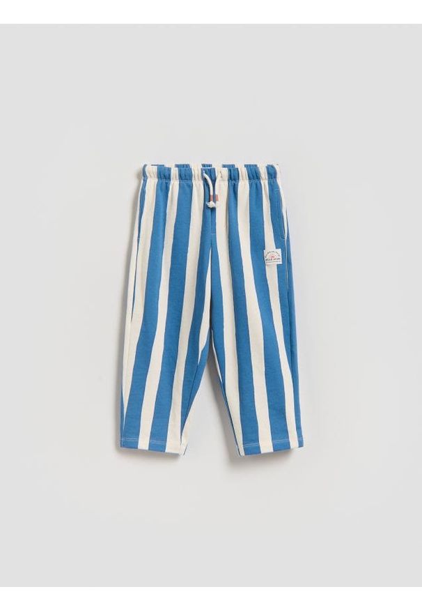 Reserved - Dresowe spodnie oversize - niebieski. Kolor: niebieski. Materiał: dresówka