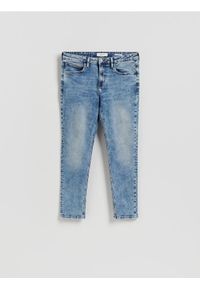 Reserved - Jeansy slim z efektem sprania - niebieski. Kolor: niebieski