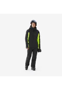 WEDZE - Kurtka narciarska i snowboardowa męska Quechua 900. Kolor: czarny, wielokolorowy, żółty. Materiał: materiał. Sezon: zima. Sport: snowboard, narciarstwo